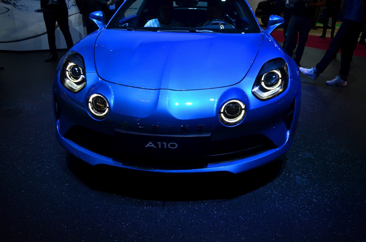 Front view showing quad round headlights and sporty curved hood