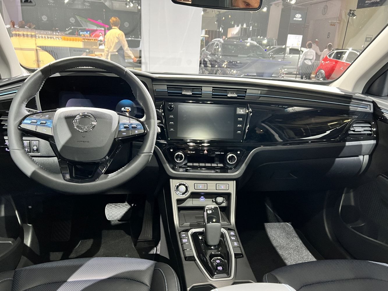 Modern dashboard with multifunction steering wheel and center console controls