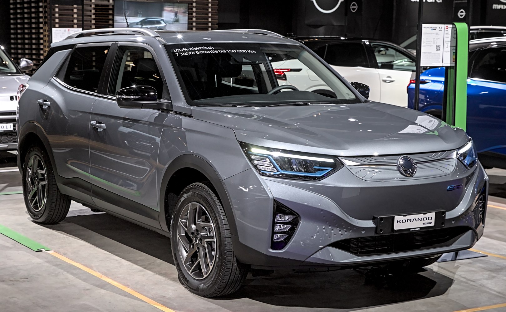 Front side view of a modern electric SUV with distinctive LED headlights