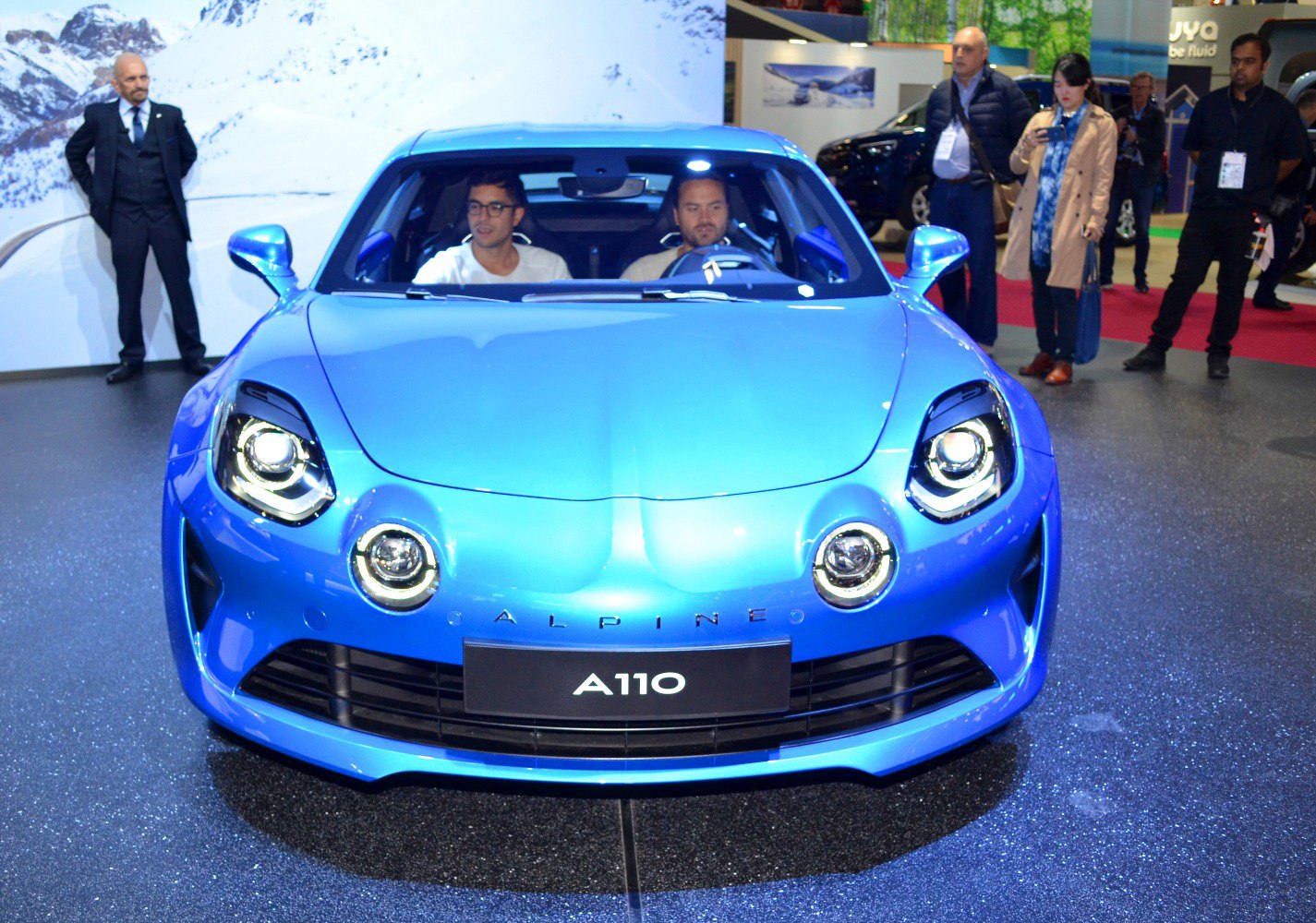 Blue sports coupe front with distinctive round headlights and fog lamps