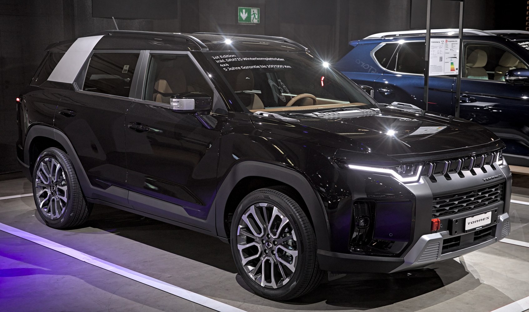 Black SUV with LED headlights, bold grille, and stylish alloy wheels