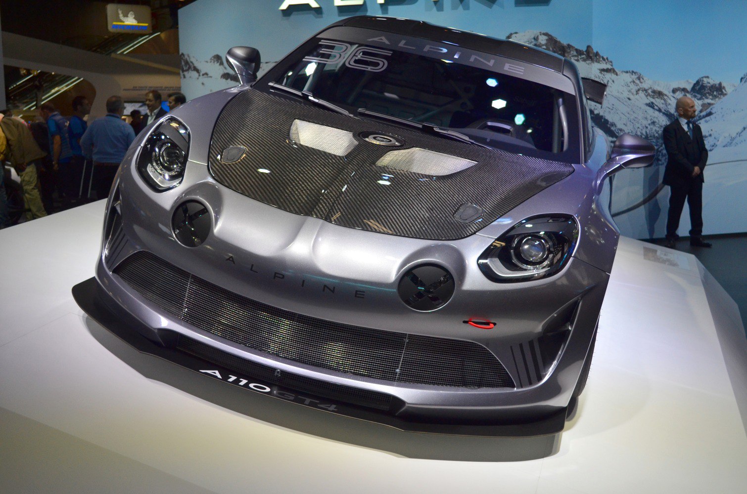 Front close-up of Alpine A110 GT4 with carbon fiber hood and aerodynamic splitter