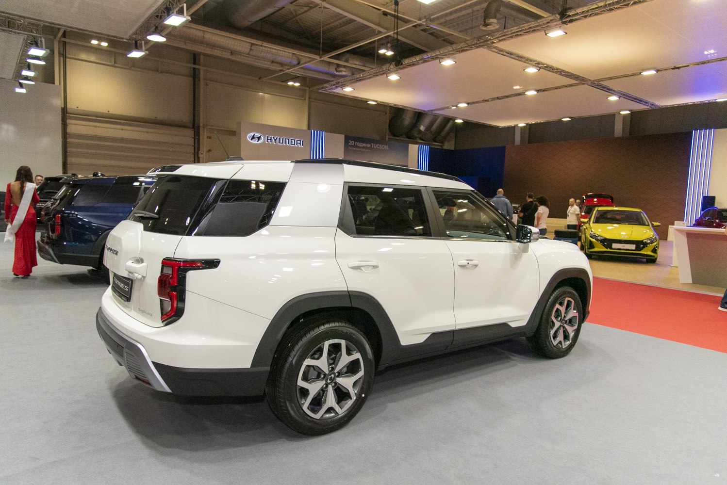 White modern SUV with distinct tail lights and black wheel arches