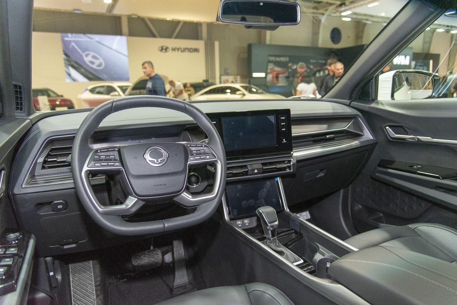 Modern car interior with dashboard and multifunction steering wheel