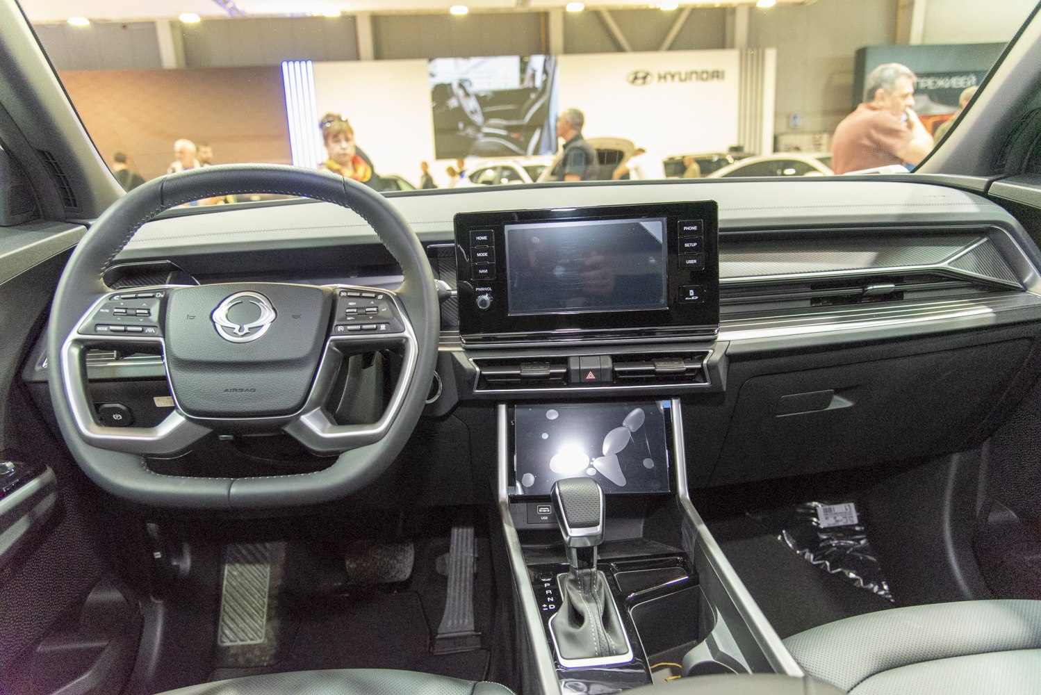 Modern car interior with digital displays and multifunction steering wheel