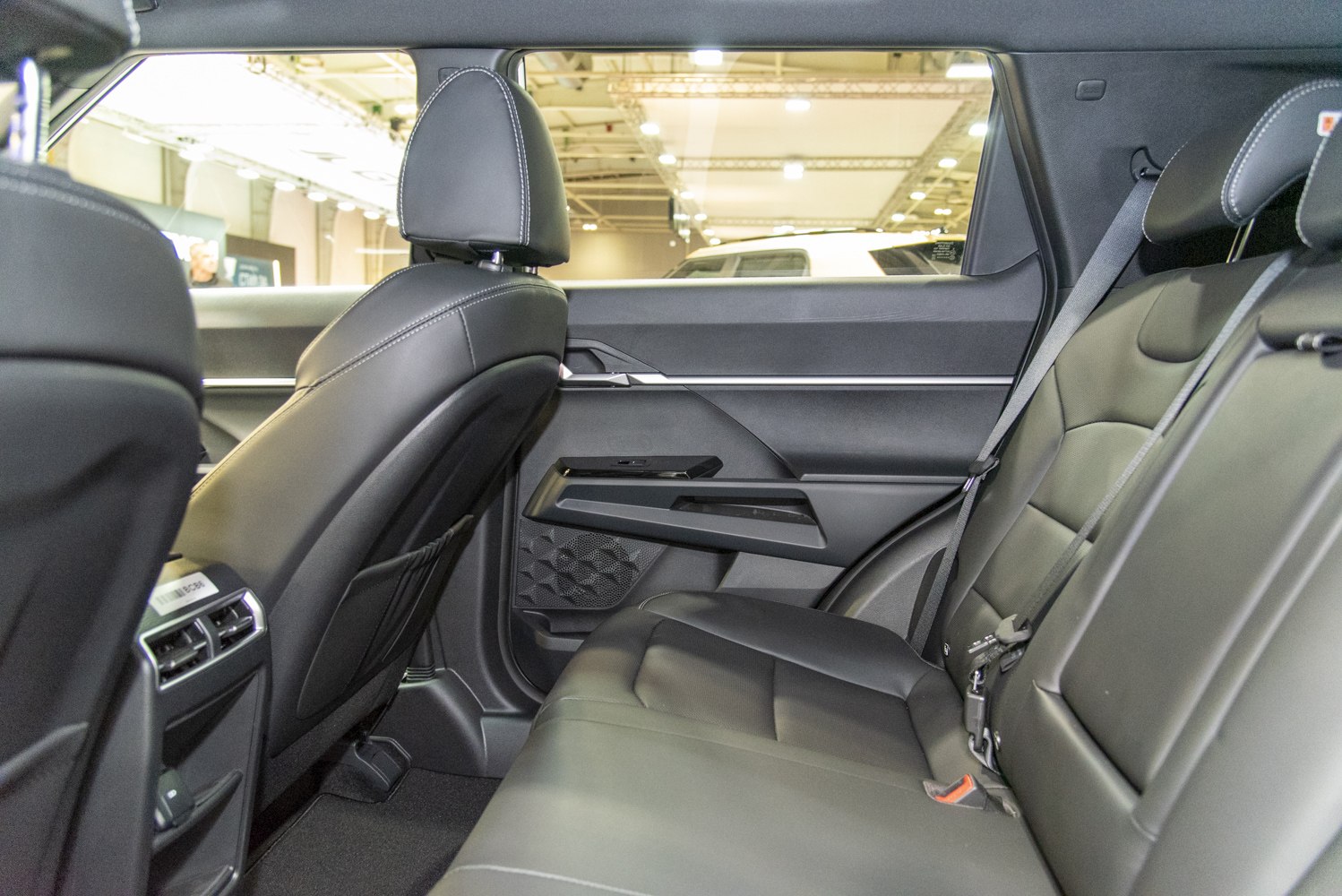 Spacious rear seating with premium upholstery and modern door panel