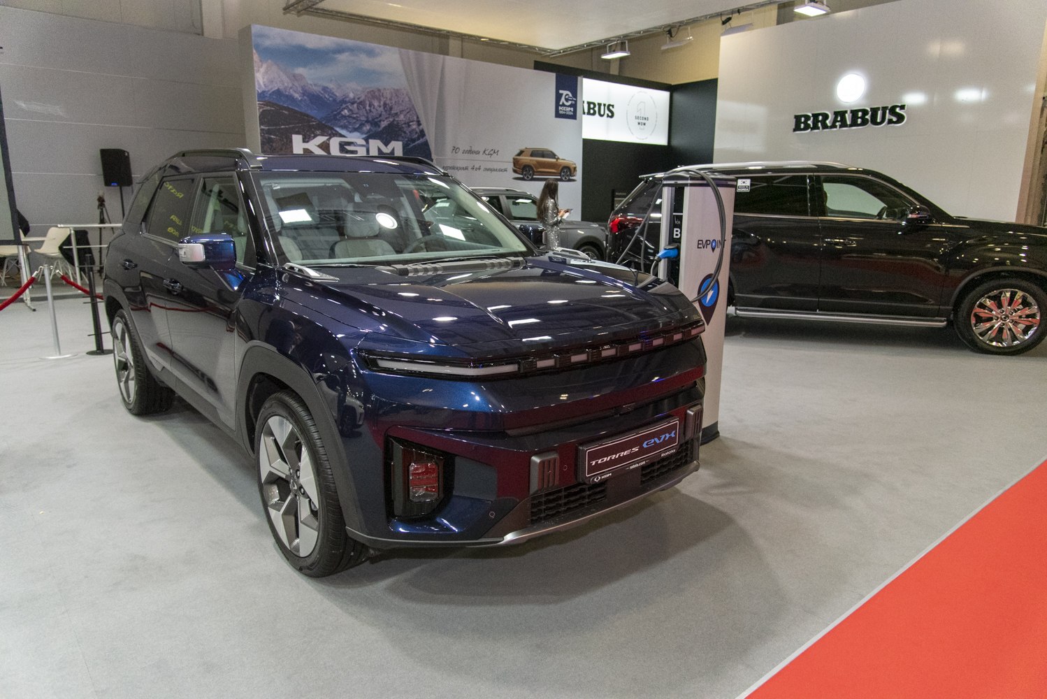 Modern electric SUV front with sleek headlights and aerodynamic body