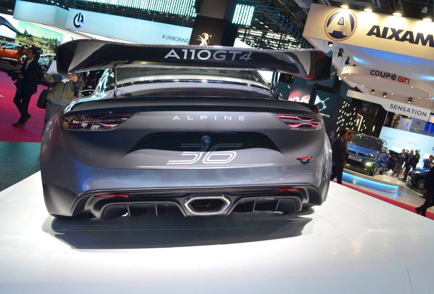 Rear with large carbon fiber rear wing and central exhaust