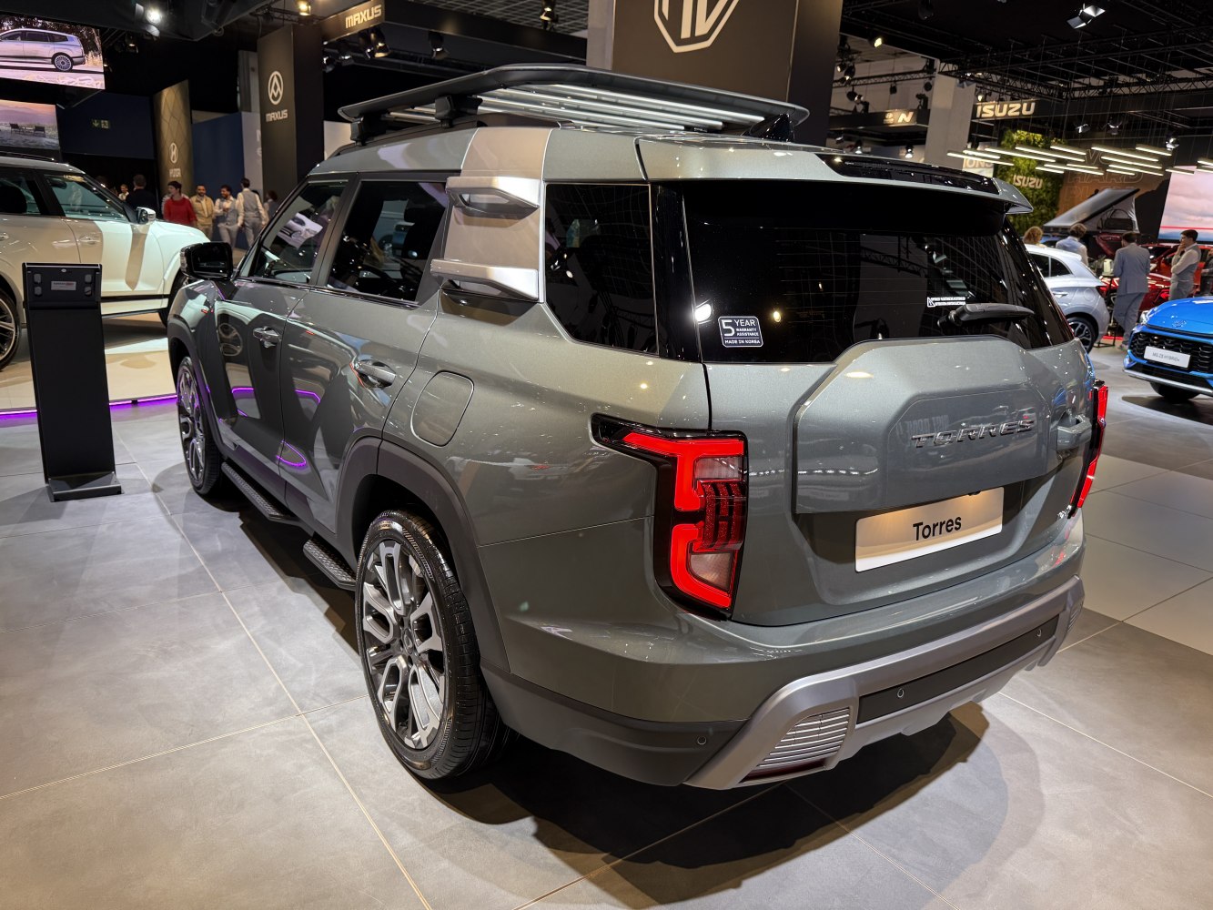 SUV rear and side view with distinctive taillights and roof rack