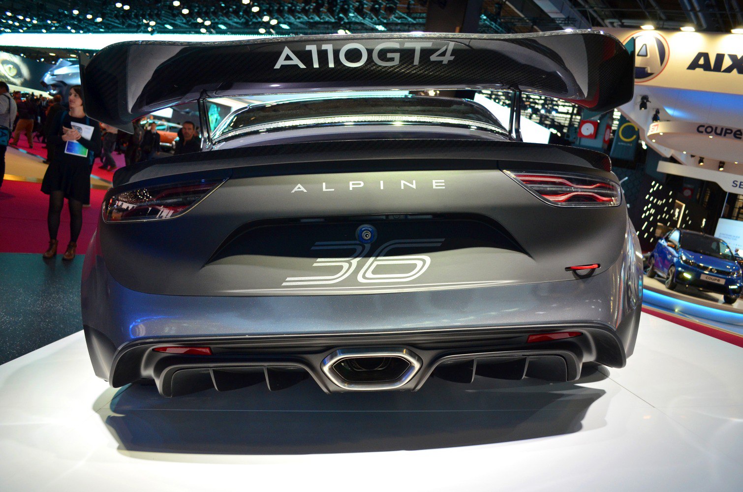 Rear with large spoiler, diffuser, central exhaust, and LED taillights