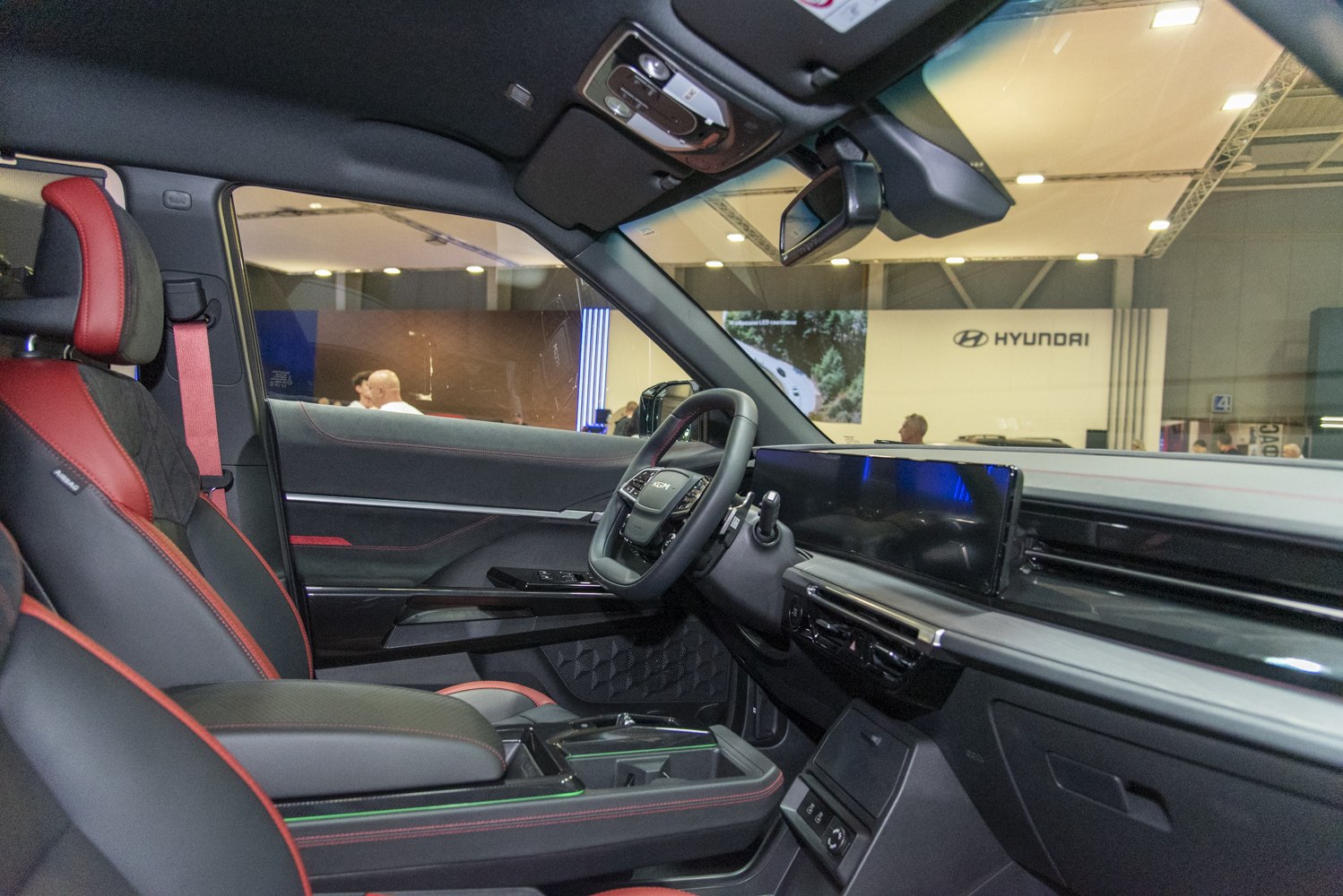 Digital dashboard and sporty red-accented seats