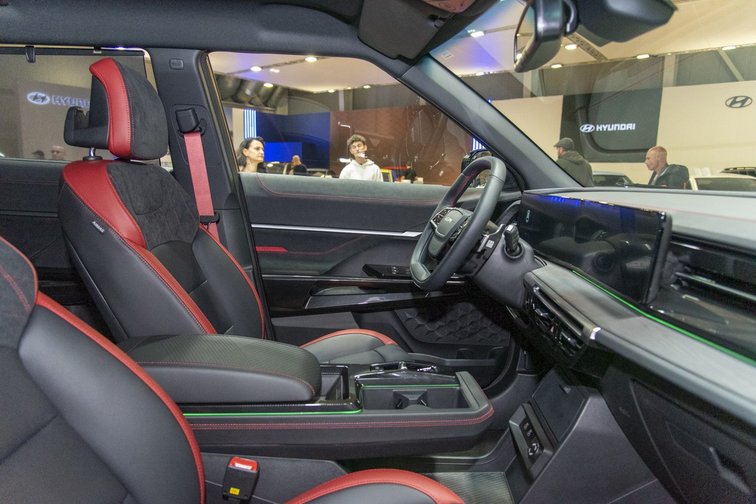 Sporty red-accented seats and sleek digital dashboard