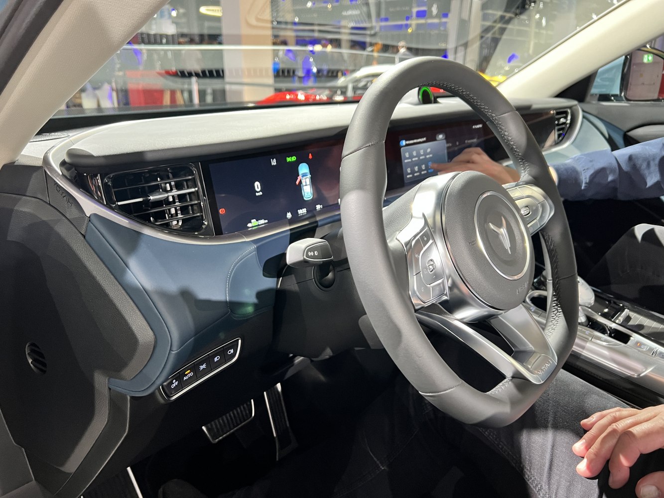 Modern steering wheel with digital dashboard and control buttons