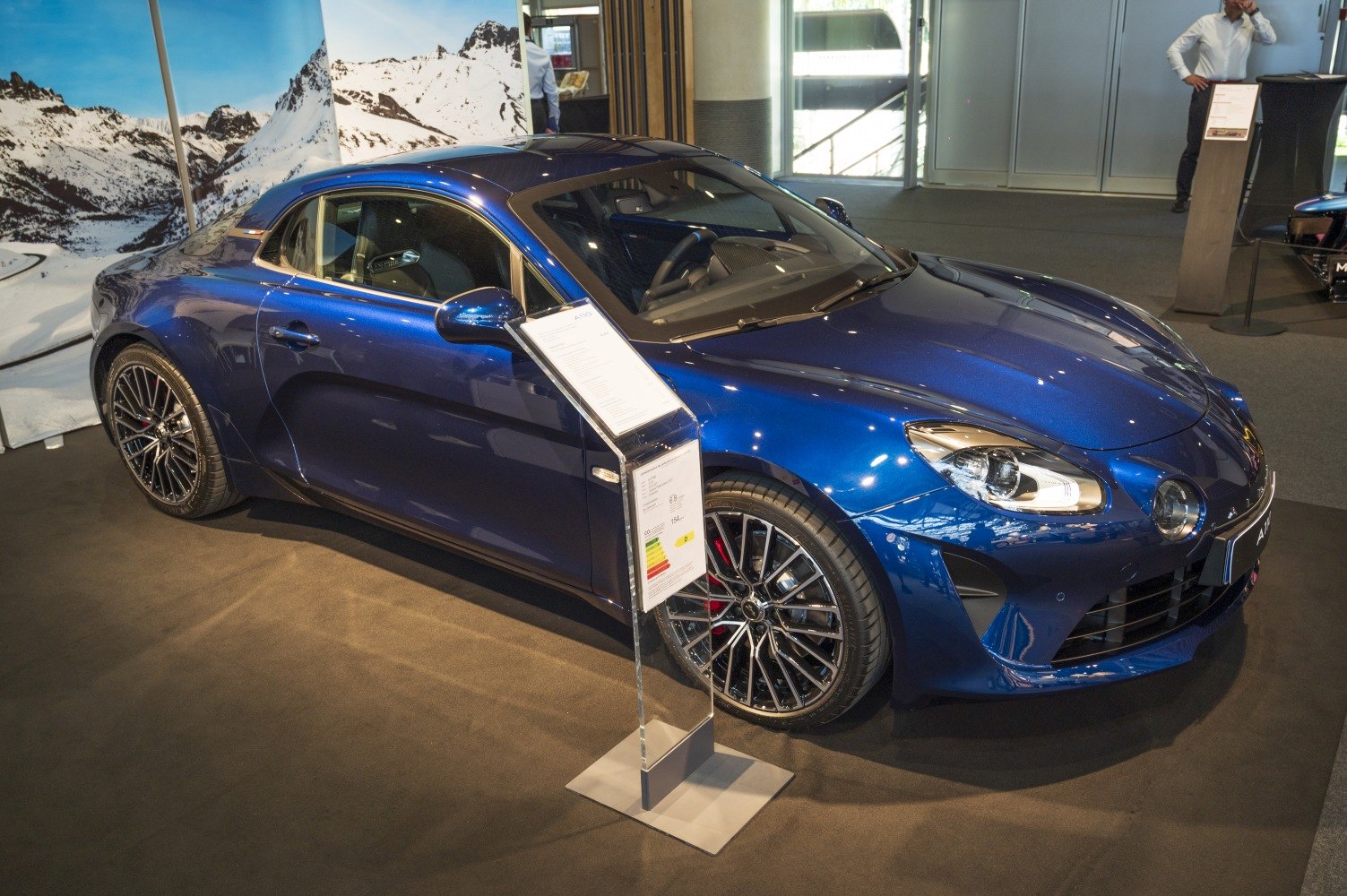 Blue sports coupe with alloy wheels and aerodynamic body design