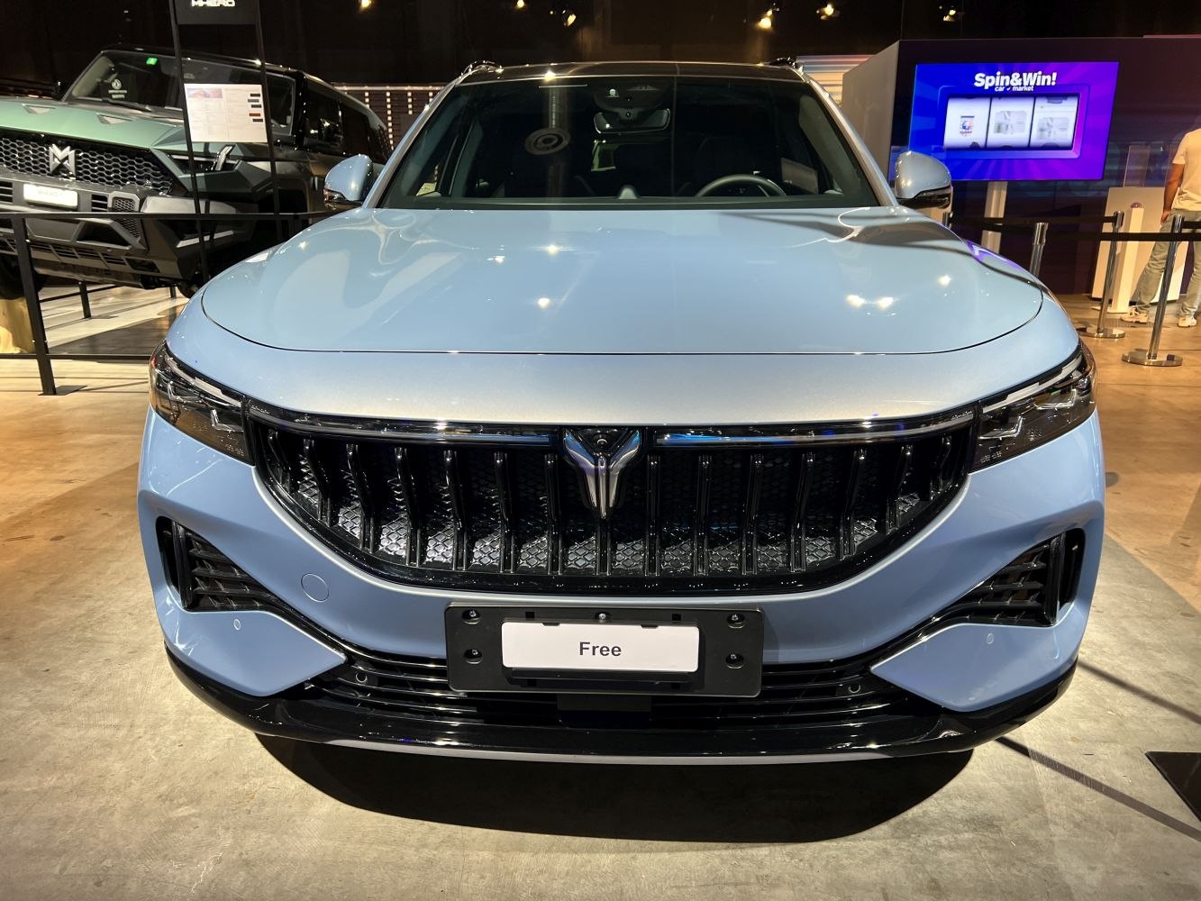 Prominent front grille and sleek LED headlights on an SUV.