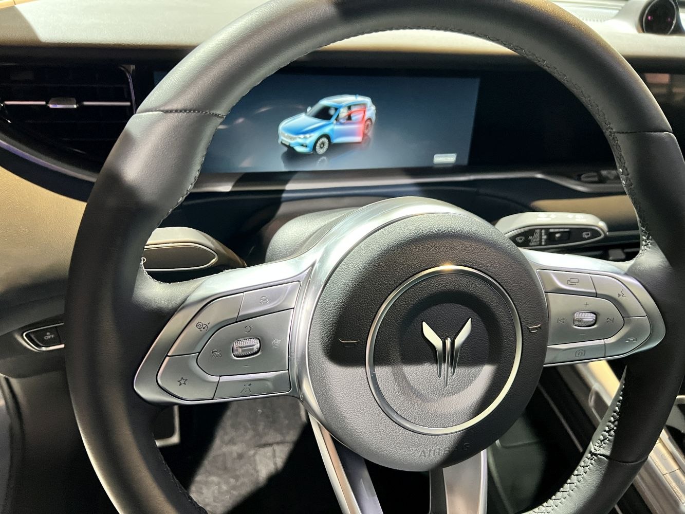 Steering wheel with multifunction buttons and digital dashboard display
