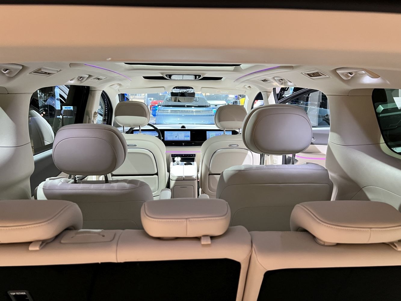 Interior view with panoramic sunroof and digital dashboard