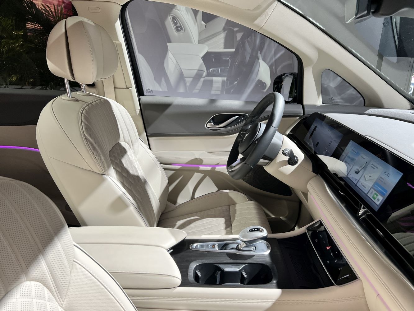 Beige leather interior with touchscreen dashboard and modern center console