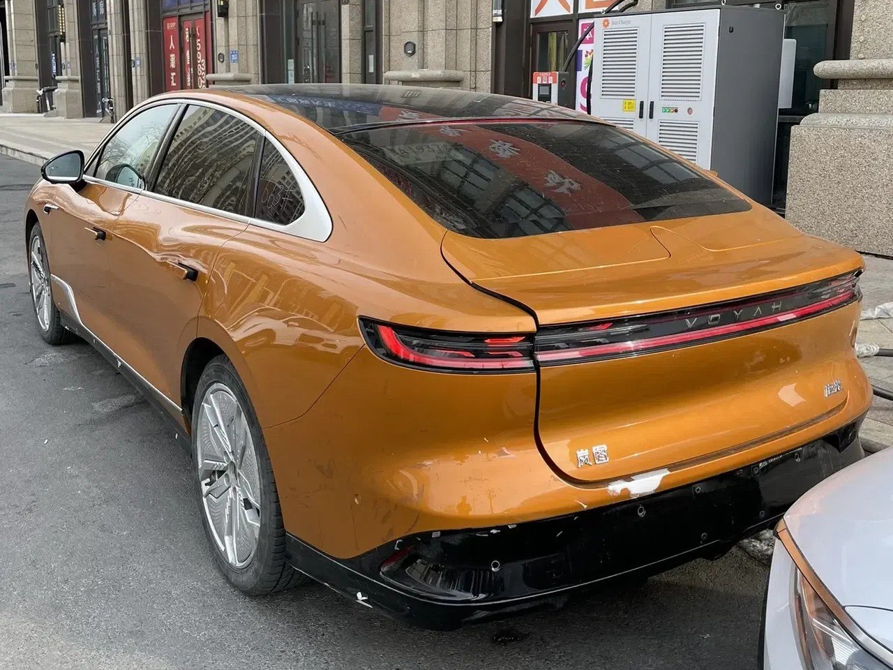 Sleek coupe silhouette with distinctive rear LED tail light strip and panoramic roof.