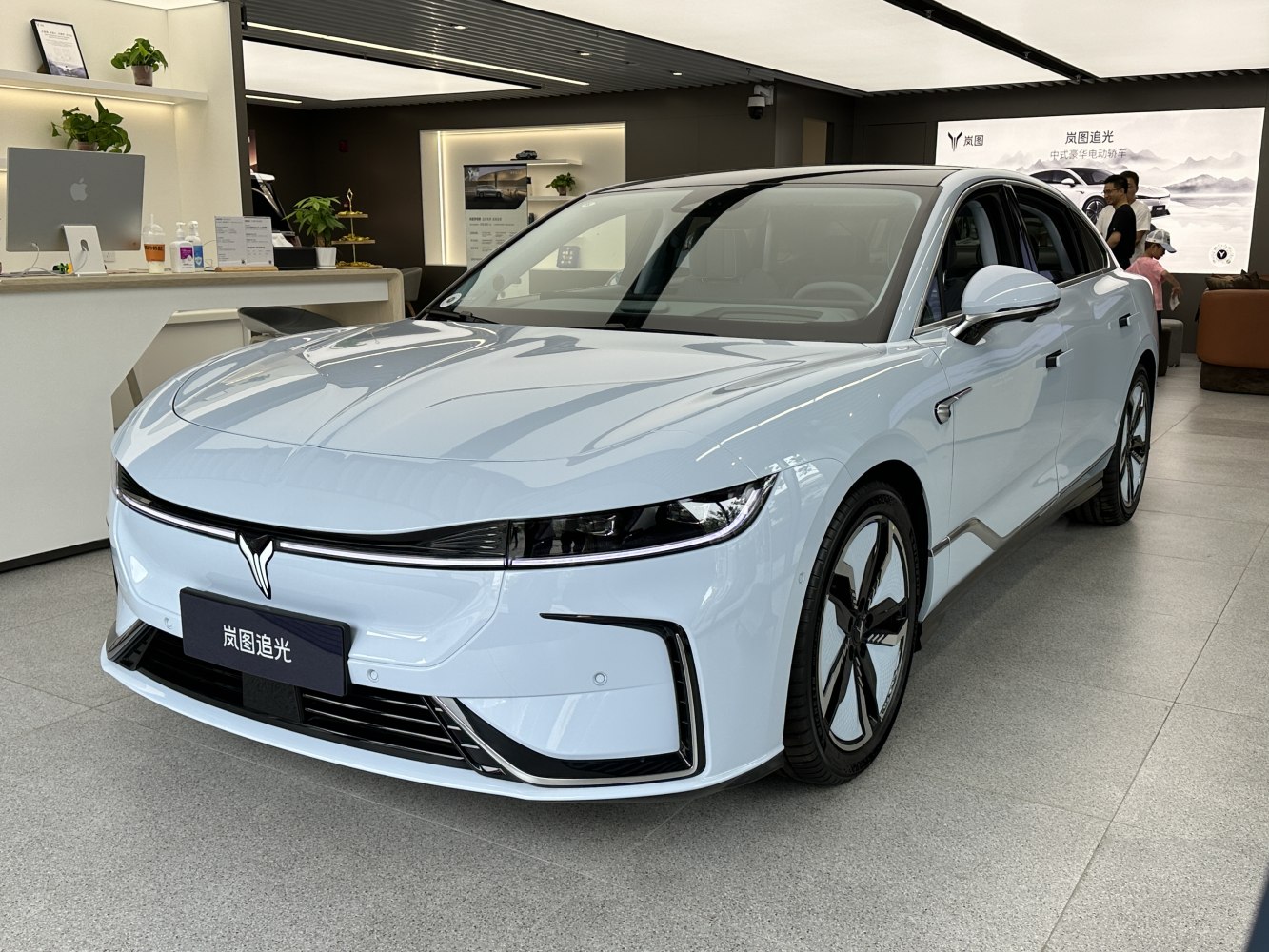 Sleek LED headlights and aerodynamic electric sedan with modern wheels