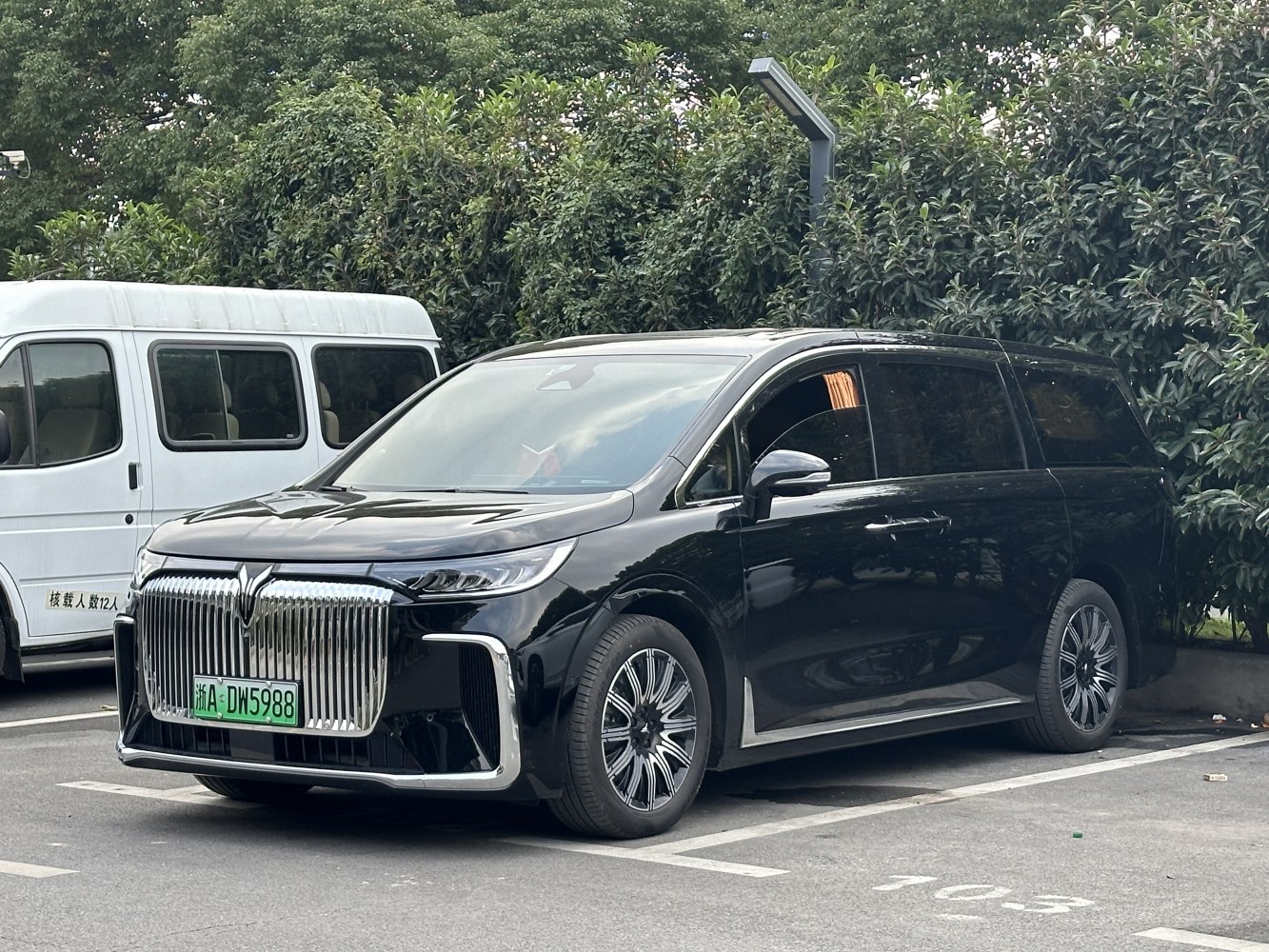 Luxury MPV with vertical slat grille and sleek LED headlights