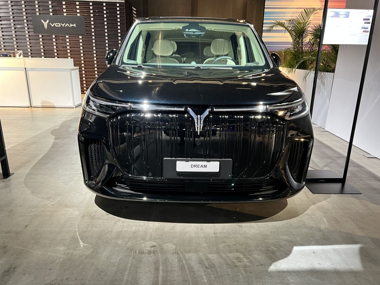 Bold grille and sleek LED headlights front view in showroom setting