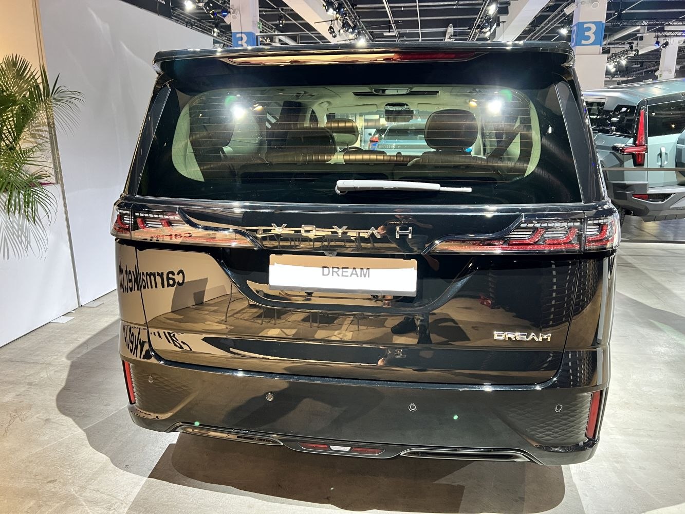 Sleek rear design with distinctive tail lights and rear window wiper