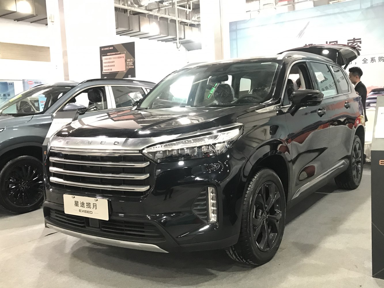 Black SUV front with bold horizontal grille and LED headlights