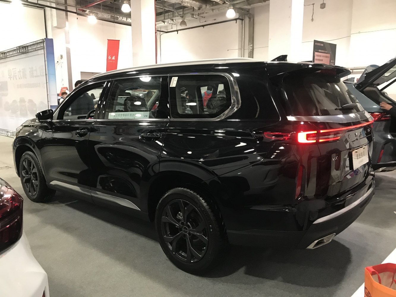 Rear and side view of SUV with LED tail lights and black wheels
