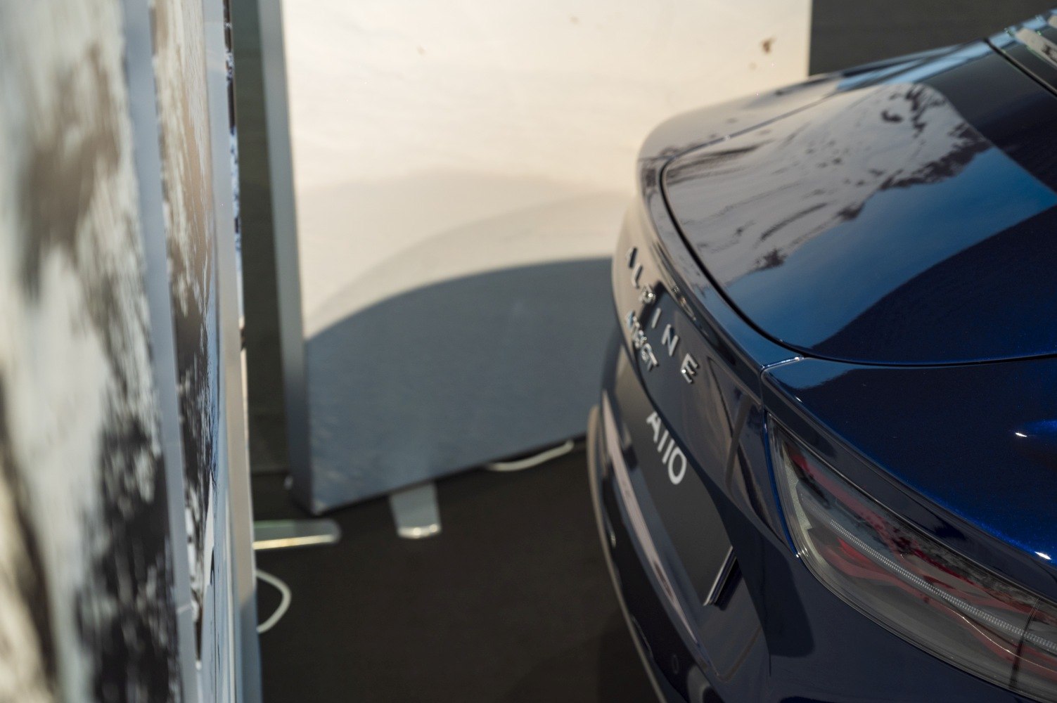 Close-up of rear badge and taillight design on a sports car