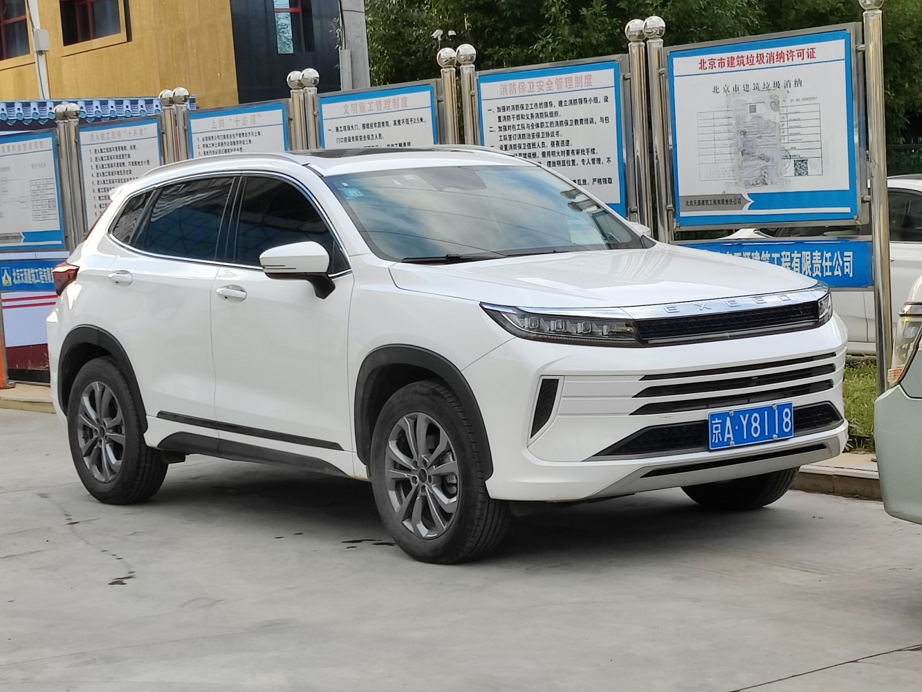 Front and side view of SUV with LED headlights and bold grille