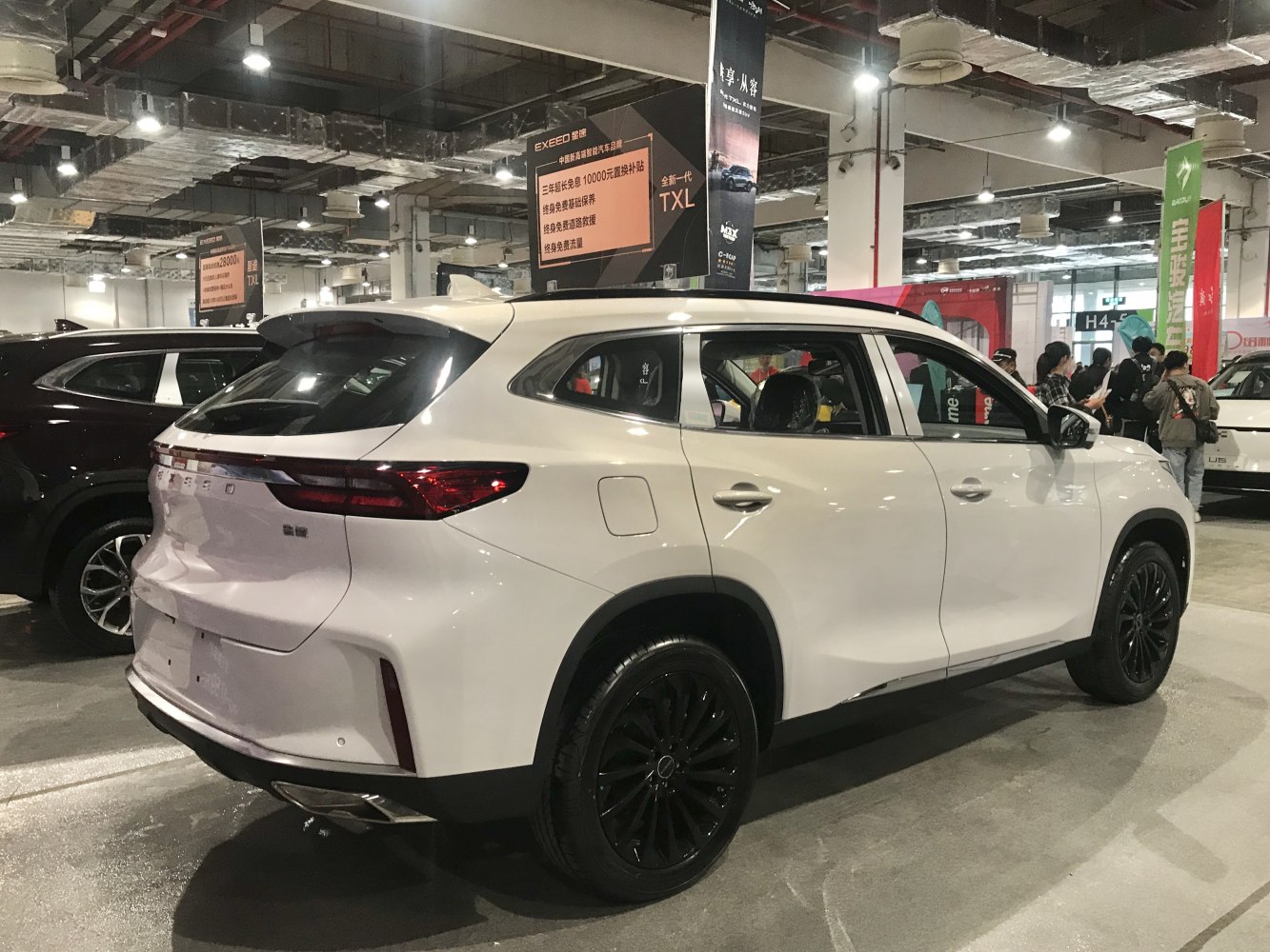 White SUV rear side with black rims and sleek tail lights