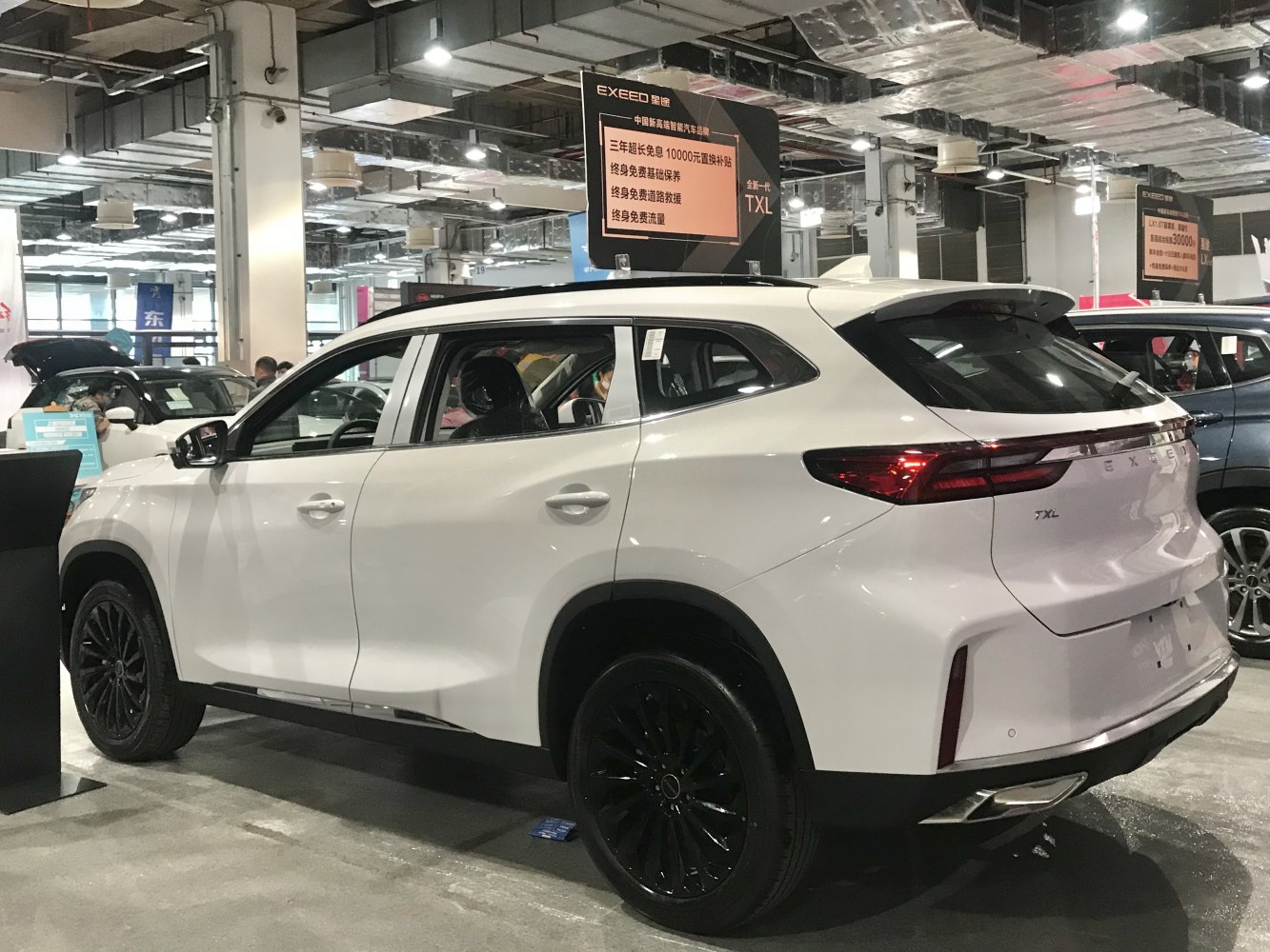 Rear side view of SUV with sleek taillights and black wheels