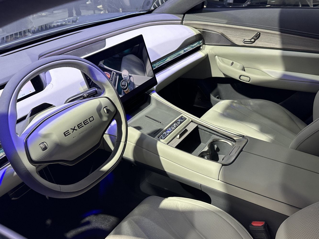 Modern steering wheel and sleek center console with touchscreen display