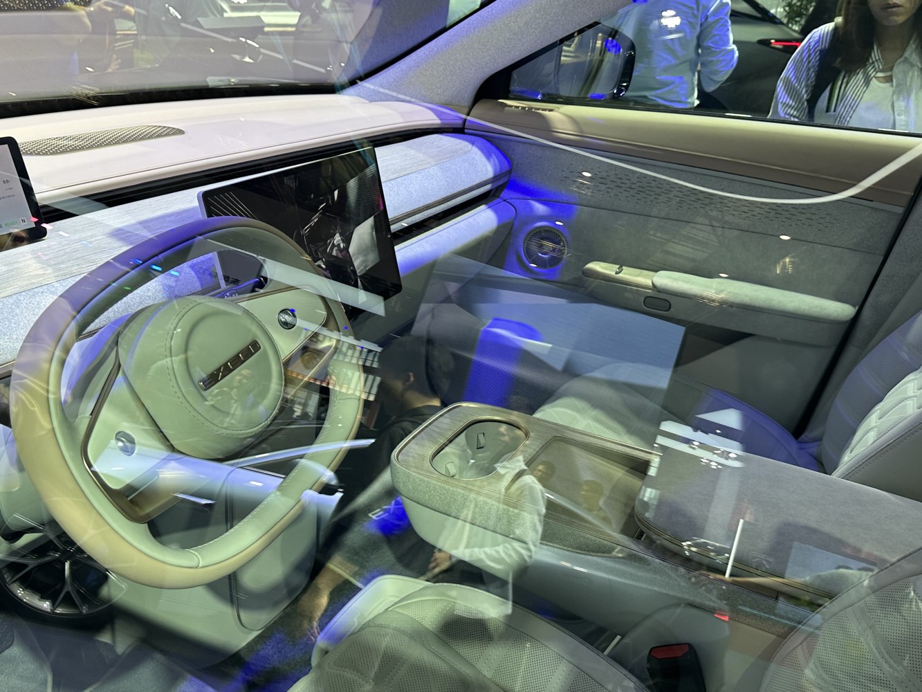 Steering wheel and digital dashboard display inside car cabin