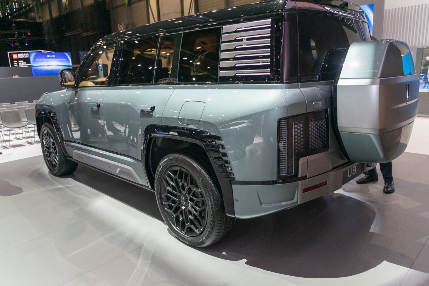 Rear side view of SUV with spare tire cover and distinctive taillights