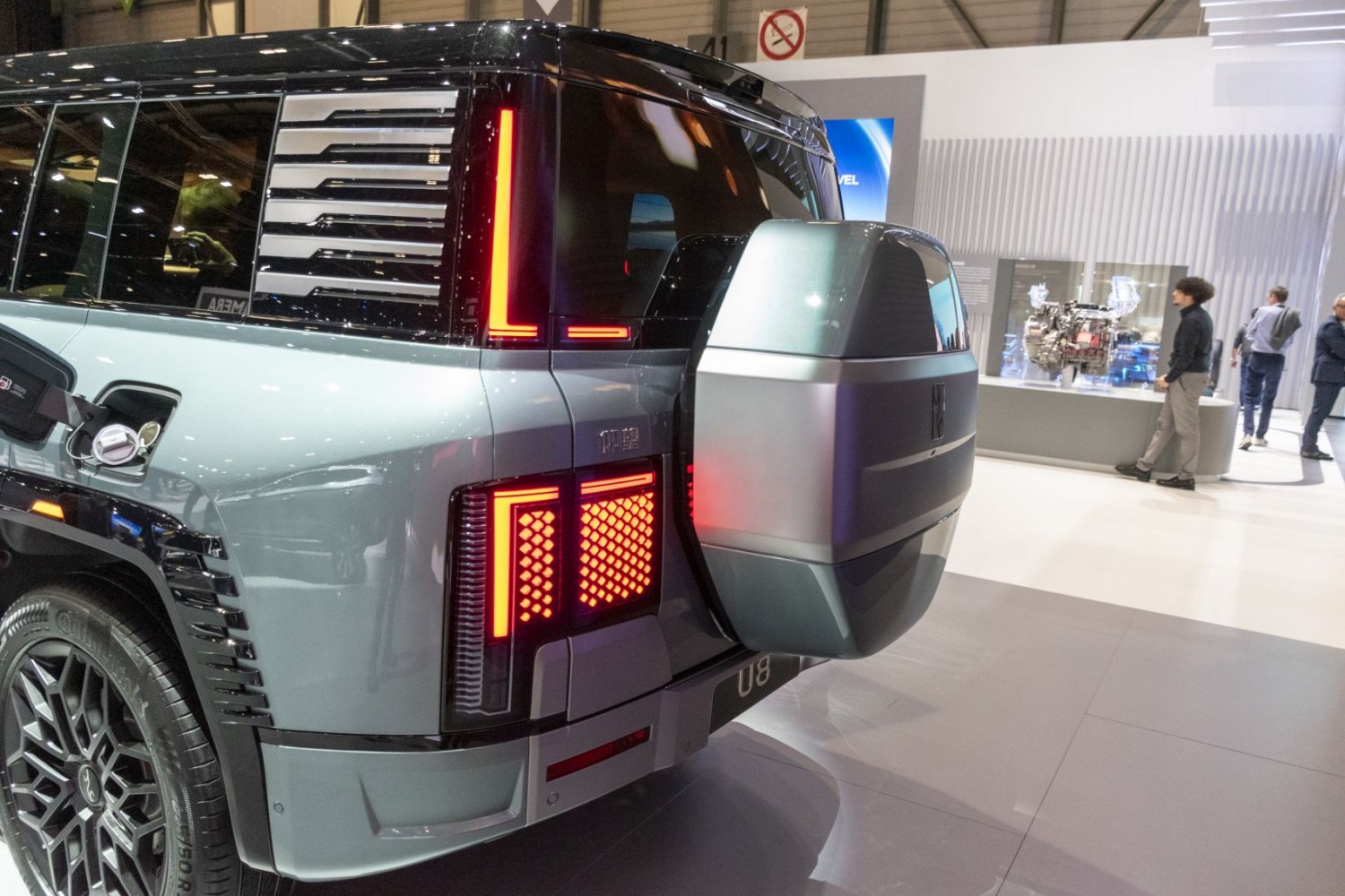 Modern LED tail lights and distinctive spare tire cover at rear of SUV