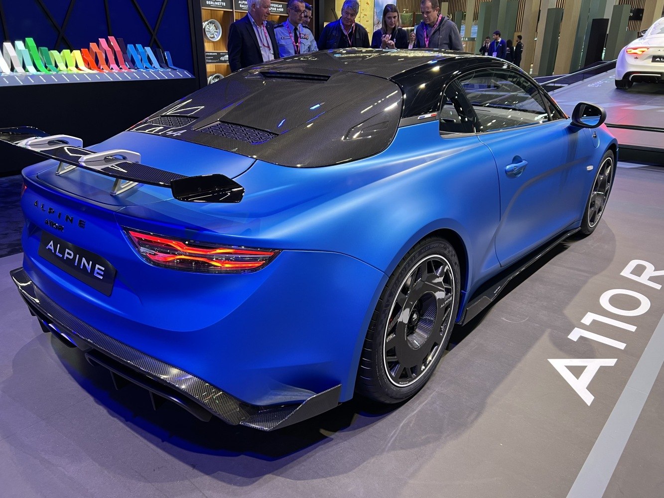 Rear view showing carbon fiber roof, rear wing, diffuser, and unique wheels