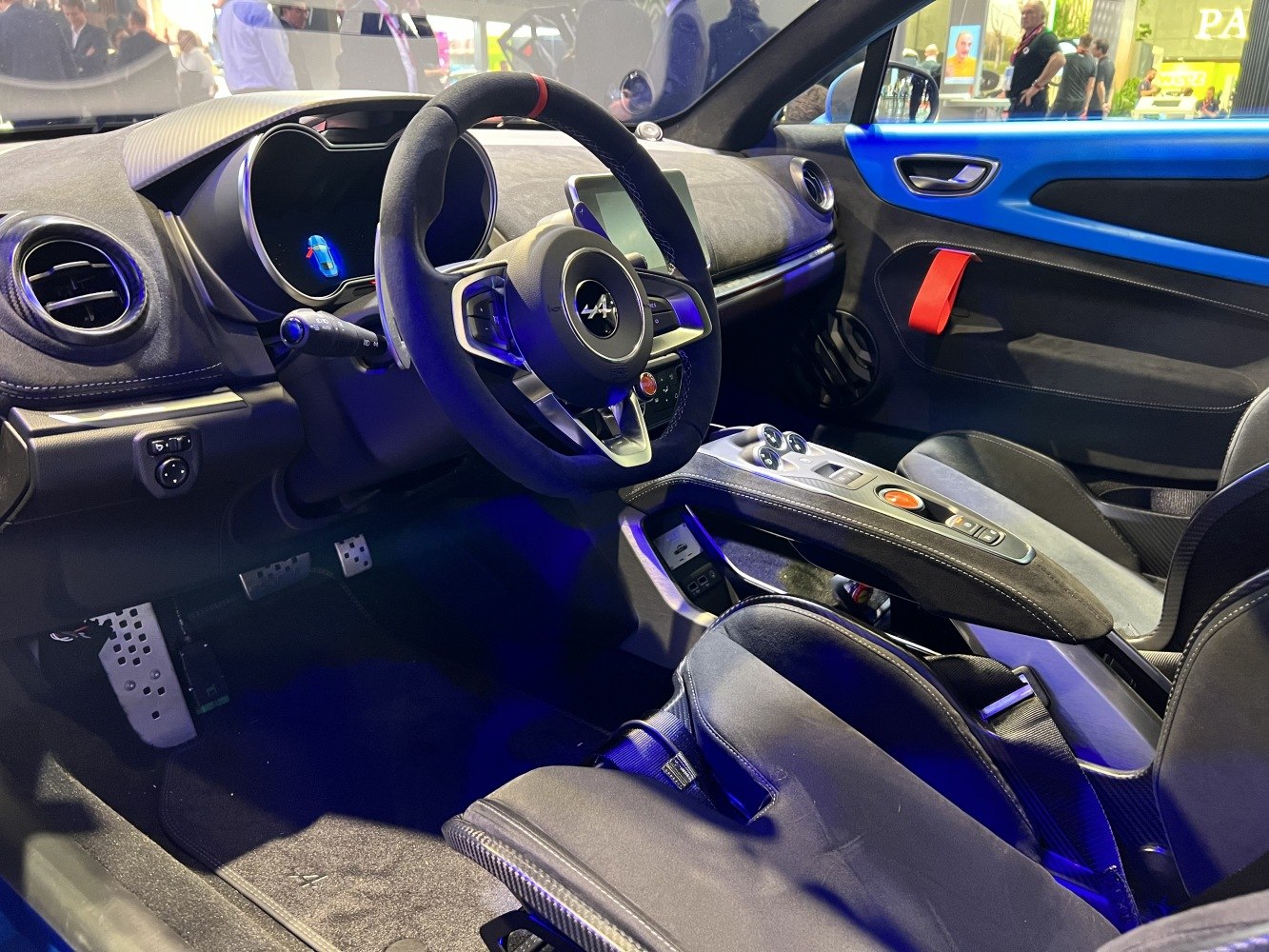 Sporty car interior with sporty seats, steering wheel, and control console