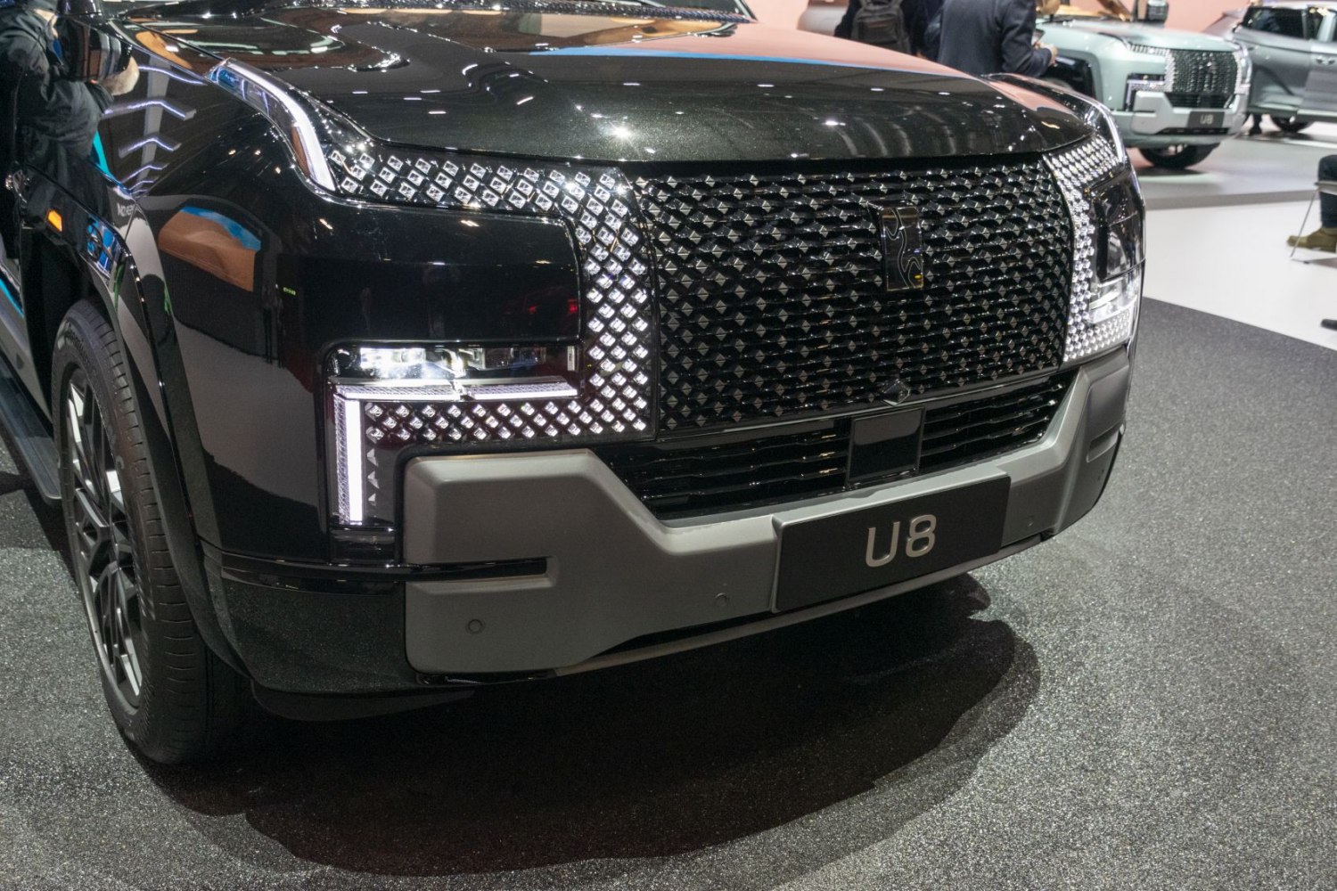 Intricate front grille and LED headlights with distinctive pattern and design
