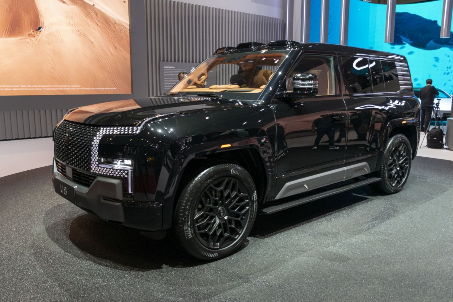 Electric SUV with bold front grille and black alloy wheels