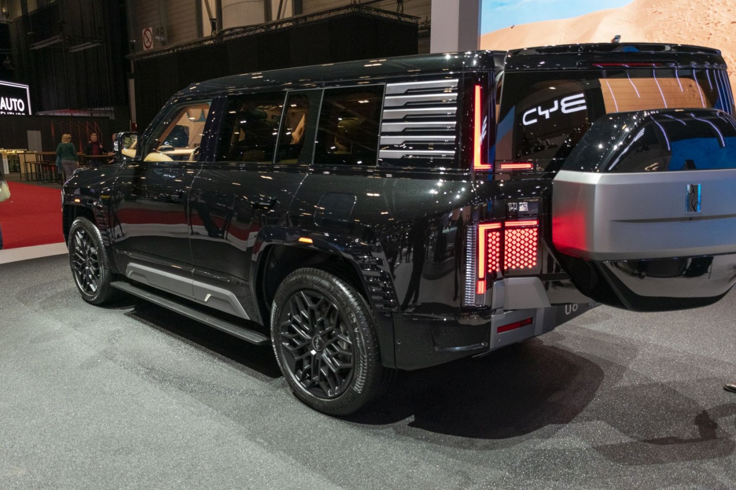 Modern SUV rear with vertical LED tail lights and spare wheel cover