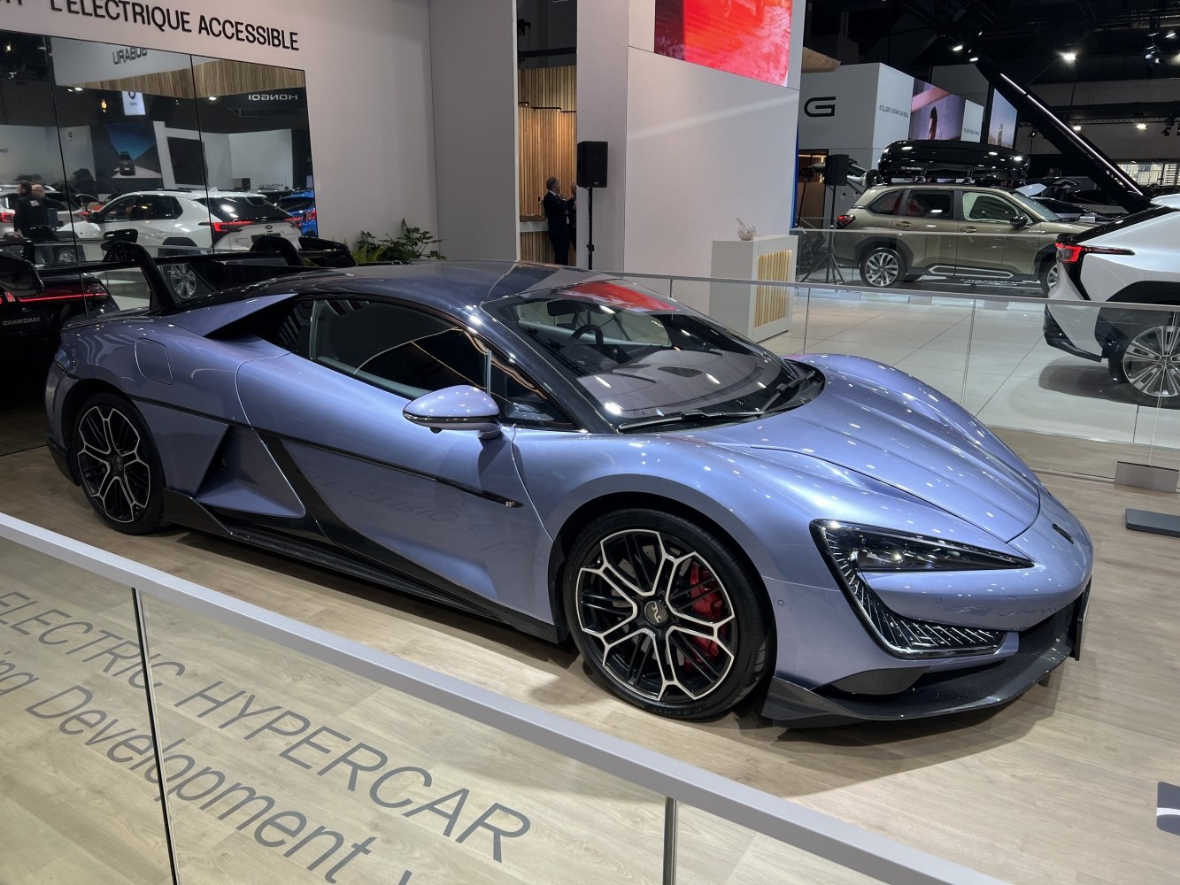Sleek electric hypercar with aerodynamic body and performance wheels