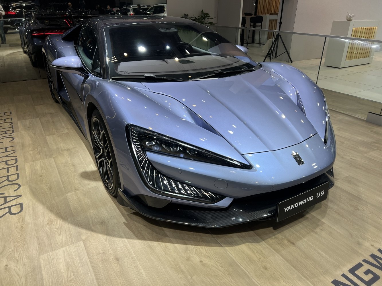 Electric hypercar with sharp aerodynamic front and distinctive LED headlights