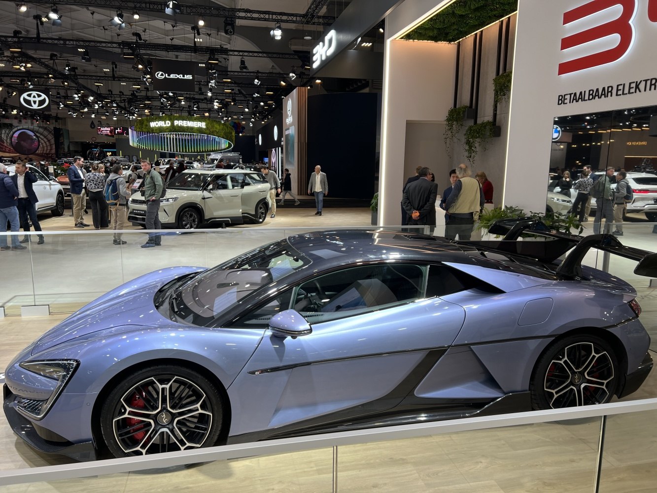 Side profile of sleek sports car with large rear wing