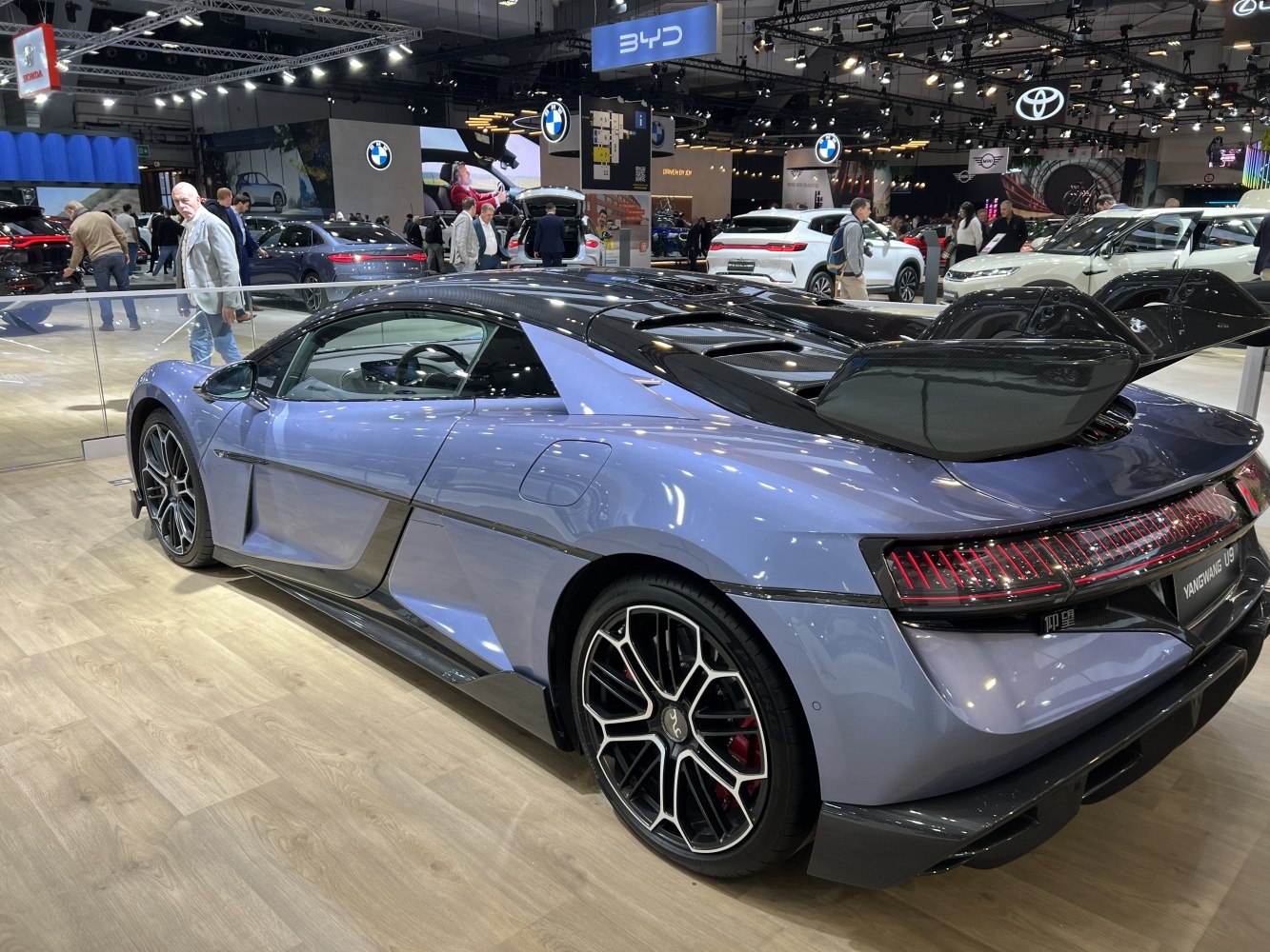 Rear and side profile with aerodynamic carbon fiber rear wing and sculpted body design