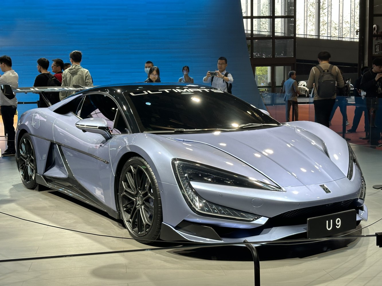 Futuristic hypercar with sleek aerodynamic body and sharp LED headlights