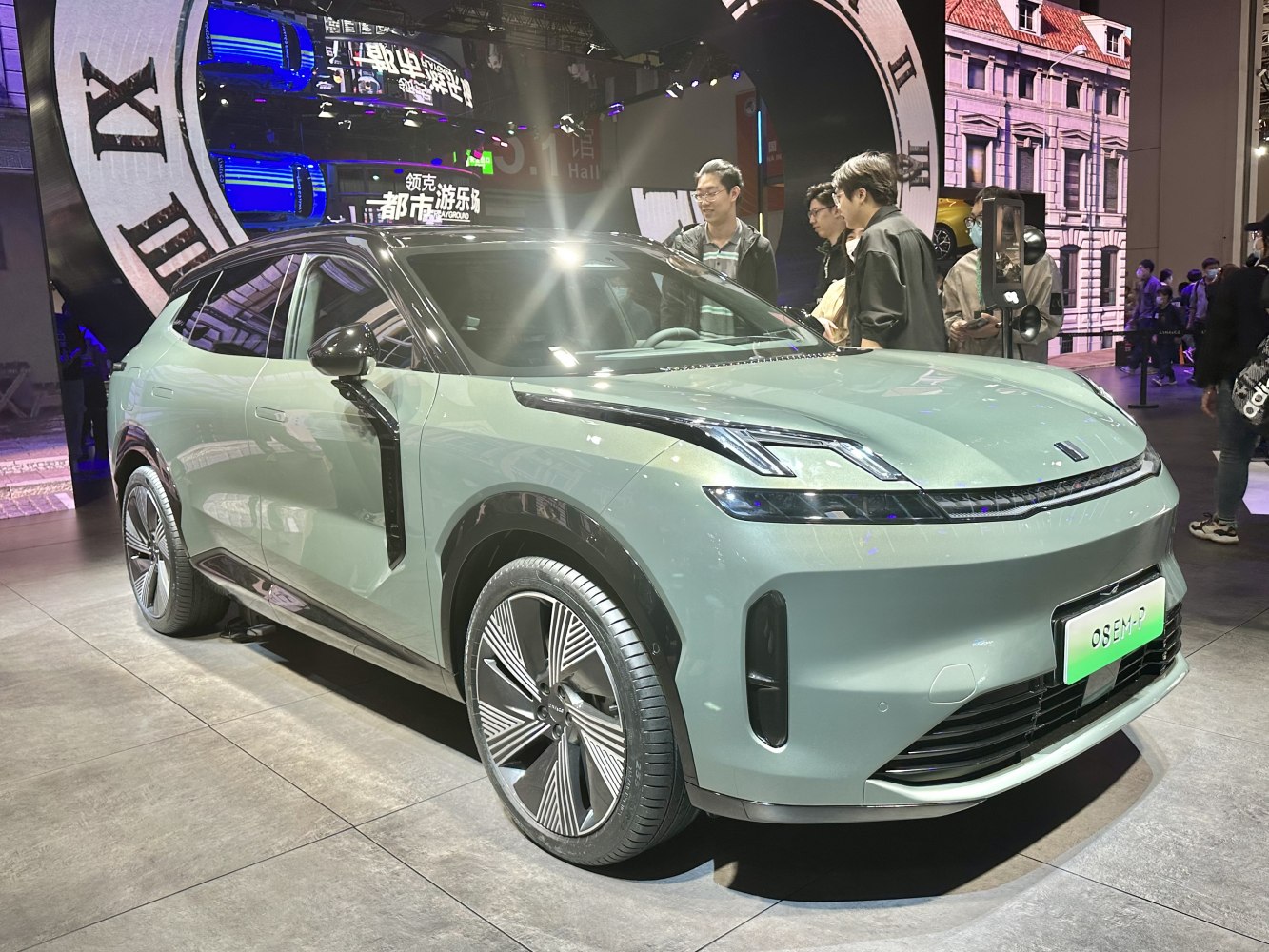 Front side view of electric SUV with sleek LED headlights and modern alloy wheels