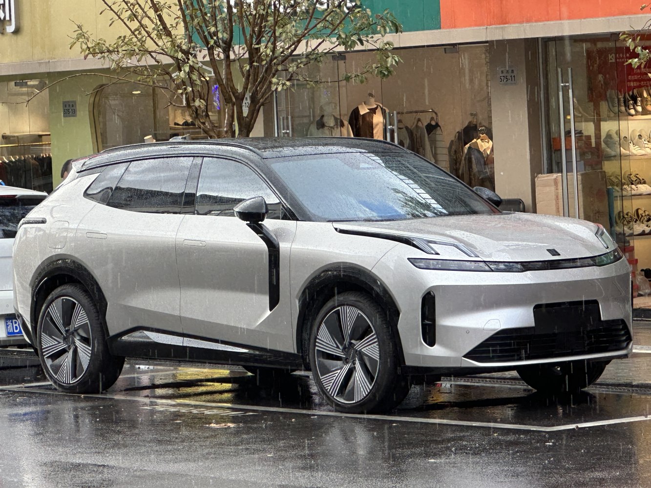 Sleek SUV front-side view with aerodynamic wheels and modern design lines