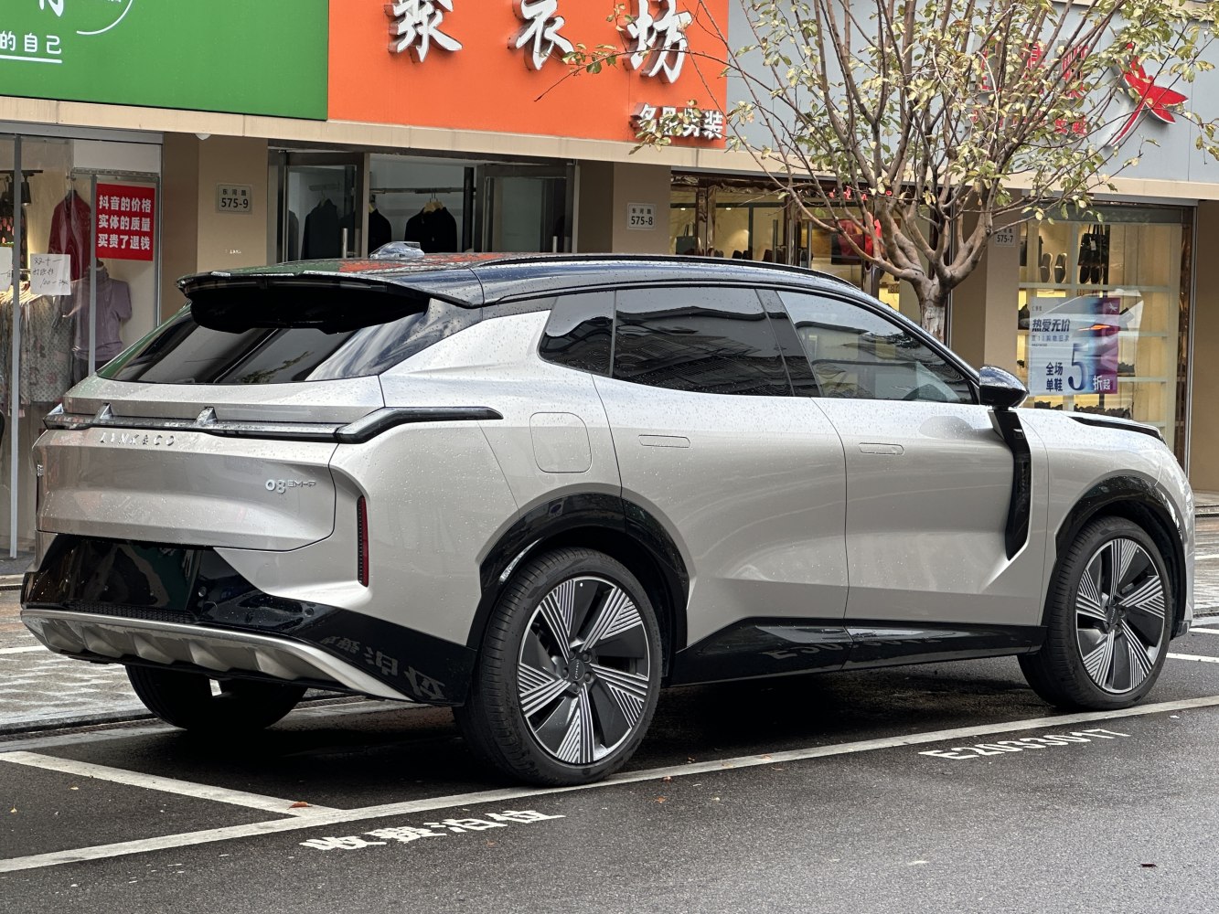 Sleek rear and side view with futuristic tail lights and aerodynamic design